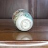 AA63 Rare 'U' shape famille verte beaker is painted with an elderly man exchanging a gift with a young girl.
