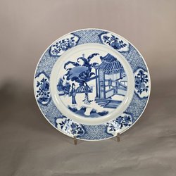 Wonderfull Chinese blue and whtie charger Kangxi)1662-172) painted in a good underglaze blue with two ladies under a plantain tree in a rocky fenced garden with a pavilion