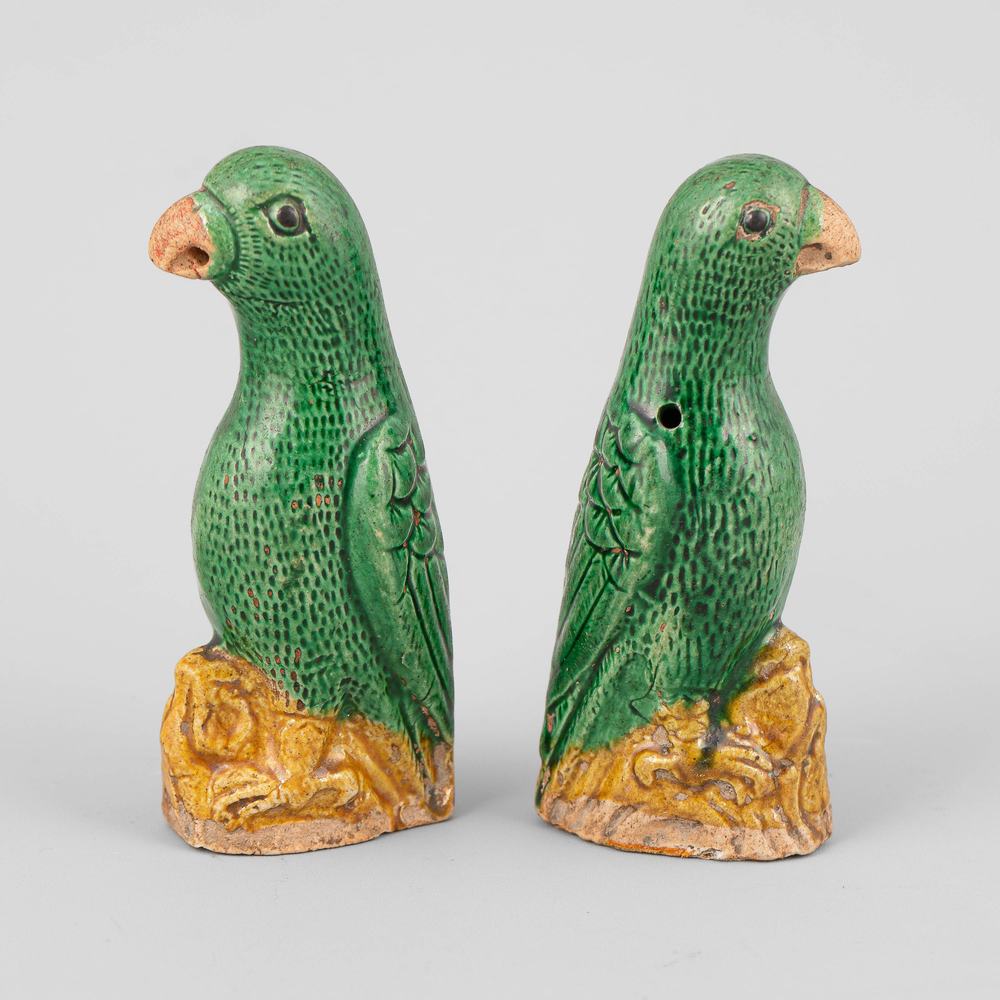 AA85 A pair of small Chinese export green and yellow glazed parrots, 18th Century, 10cm high   Provenance: Jorge Welsh