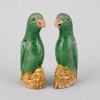 AA85 A pair of small Chinese export green and yellow glazed parrots, 18th Century, 10cm high   Provenance: Jorge Welsh