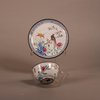 W920 A Chinese Qianlong Canton enamel tea bowl and saucer, each painted with a scene of an Asiatic pheasant seated on a branch with prunus flowers, rocks and large flowers below, the borders painted with t