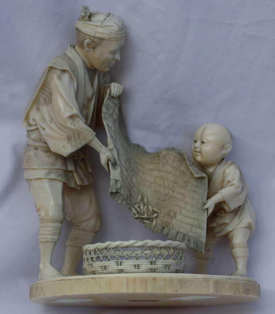 R421 Japanese ivory carving of a farmer and a boy loading a basket