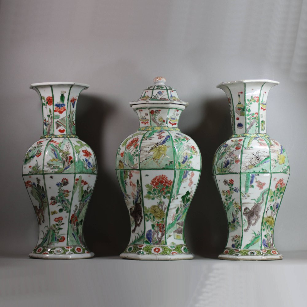 U436 Garniture of three famille verte octagonal vases