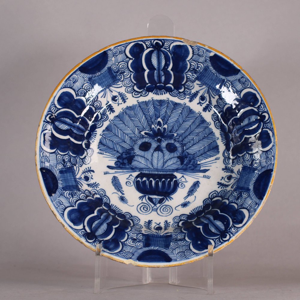 W500 Dutch delft blue and white 'Peacock' plate, 18th century,    underglaze blue mark of De Porceleyne Claeuw to base with figure, diameter: 22.7cm. (8 15/16in.), condition: frits to ochre rim and 2 shall