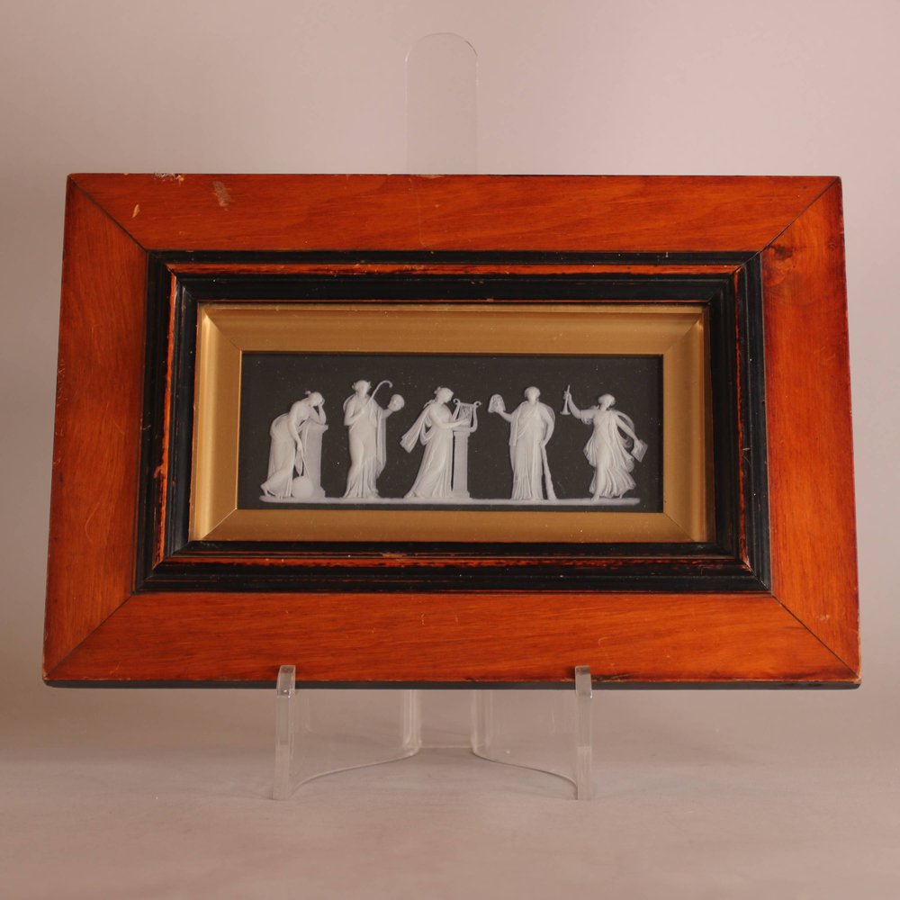 W817 A framed Wedgwood jasperware muses plaque, 19th century