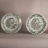 W879 Pair of Chinese 'European-subject' dishes, Qianlong (1736-95), each decorated with an interior scene depicting a lady sewing with a port visible through a window above.