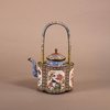 W918 A Chinese Qianlong enamel teapot and cover, with looped fixed handle,