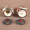 W921 A pair of early Chinese Qianlong Canton enamel pomode pots and covers,