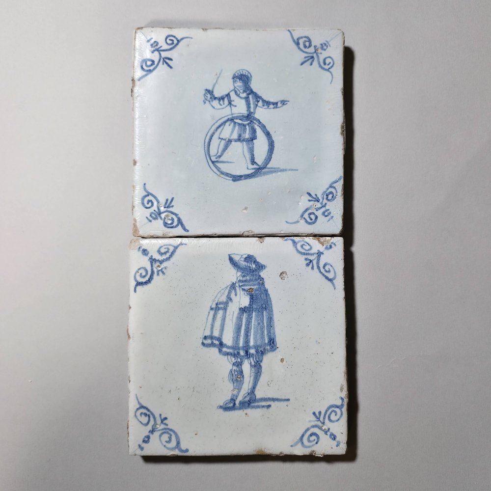W949 Two figurative Dutch delft tiles; 17th century