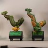 W990 Pair of MIng tile figures in the form of dynamic leaping carp in lead green and yellow glazed