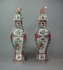 X148 Pair of famille rose octagonal-shaped vases and covers