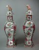 X148 Pair of famille rose octagonal-shaped vases and covers