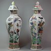 Y66 A matched pair of Chinese hexagonal baluster vases and covers