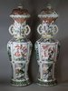 Y906 A pair of large famille verte lobed baluster vases and covers